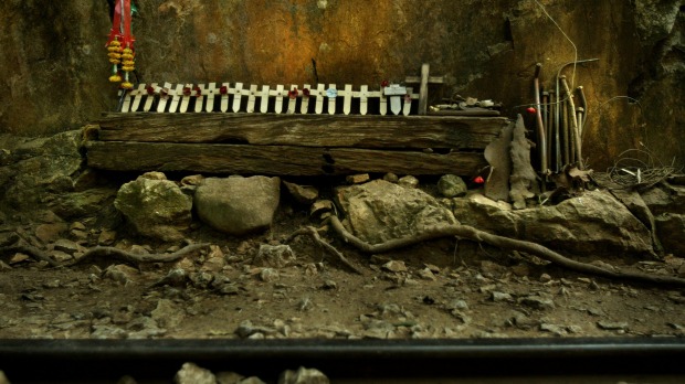 Remembrance crosses sit among the railway sleepers, rail pegs and track at the site of the infamous Hellfire Pass, built from 1942 to 1943. Photo: Kate Geraghty