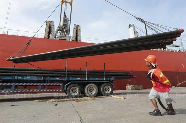 A worker unloads steel products imported from China. To avoid competition with cheap Chinese steel, The Steel Plc is branching into the power-generating sector.