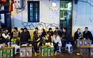 street food Hanoi Vietnam Breaking bread together: friends in Hanoi, Vietnam - one of the top countries for making expats feel welcome