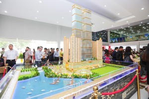 A man looks at a model of the $1 billion twin towers, which will begin construction in the middle of this year.